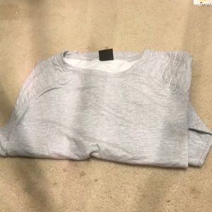 Grayish white fleece lined sweater